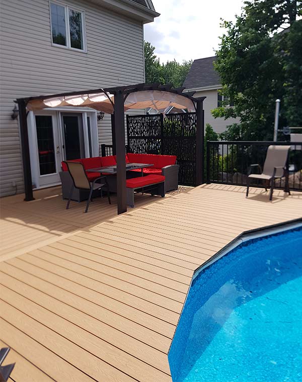 Deck around a pool composite-deck-around-a-pool-with-pergola-and-outdoor-furniture---multi-level-deck-in-colour-sand-beige-design-line---available-in-Mississauga-brampton-caledon-ontario-canada